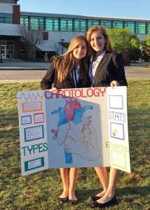 (L-R) West Ashley High students Alex Ryan and Olivia Brazelton display their Health Career Team event poster before their presentation at the South Carolina HOSA State Leadership Conference.